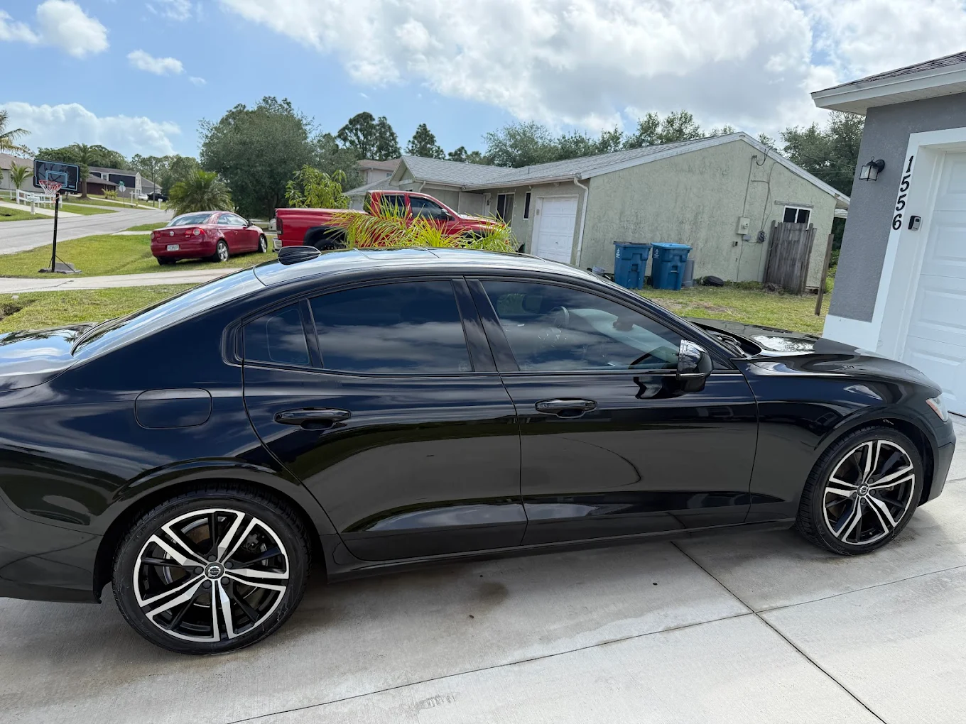 Black Volvo sedan residential detail