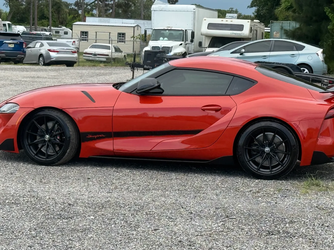 Red Toyota Supra side view
